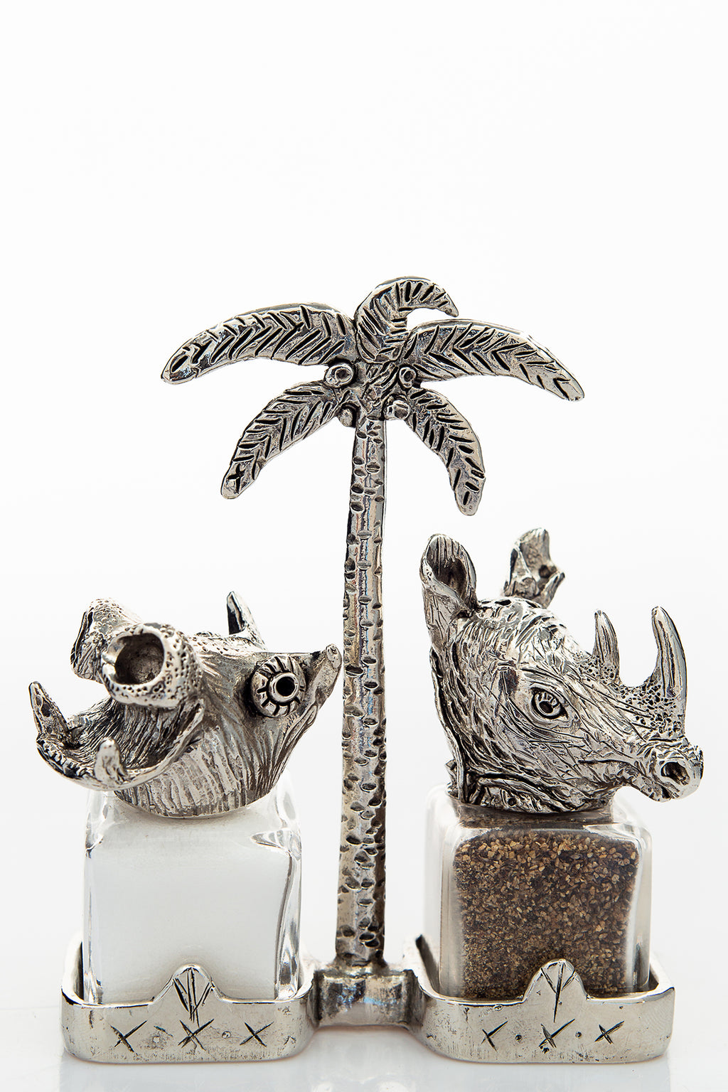 Hippo and Rhino salt and pepper shakers with a palm-tree carrier, handcrafted by German artist Thomas Leiblein. American pewter, made in the USA.